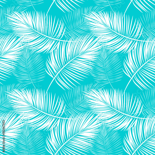 seamless pattern of white fern leaves on a blue background