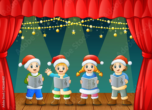 Cartoon children singing christmas carols on the stage