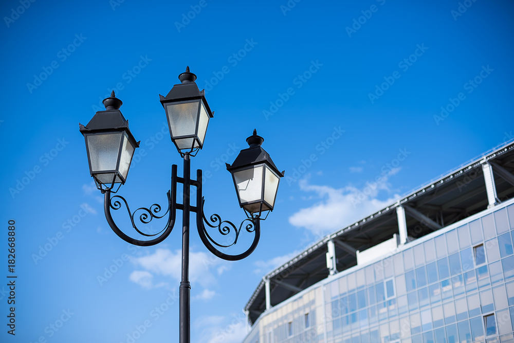 street lamp near a building against the blue sky