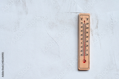 thermometer on a gray wall