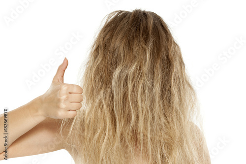 Tableau sur toile Blonde with messy hair, showing thumbs up