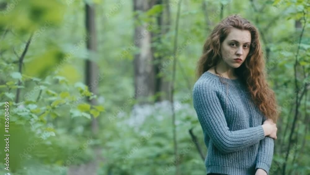 Young redhead girl in forest Young redhead girl in forest