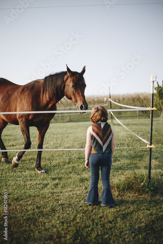 Little girl playing with a horse © Rawpixel.com