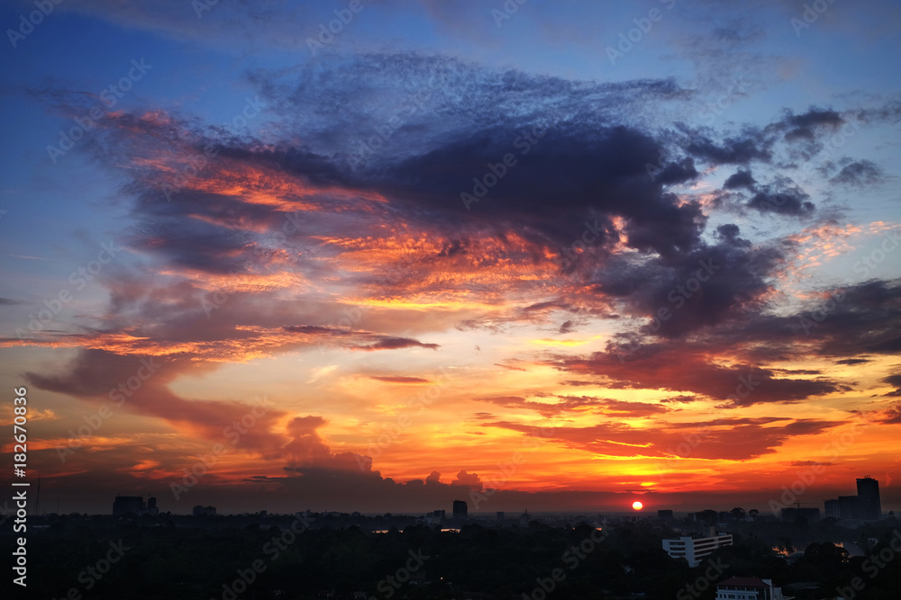 Amazing sunlight of sunset reflected on clouds in the sky in Yangon city, Myanmar Amazing sunlight of sunset reflected on clouds in the sky in Yangon city, Myanmar