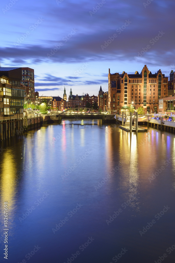 Illuminated port Magdeburger Hafen with warehouse district in the background, Hafencity, Hamburg, Germany Illuminated port Magdeburger Hafen with warehouse district in the background, Hafencity, Hamburg, Germany