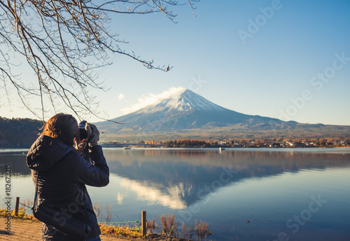 Wallpaper Mural Back of asian woman traveler taking photo of  fuji san mountain at Kawaguchiko lake, Japan Torontodigital.ca