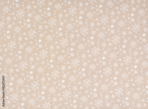 white transparent falling snowflakes on beige