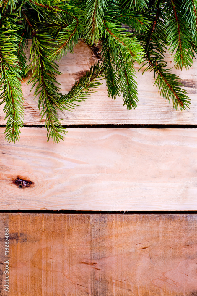 Christmas fir tree on natural wooden background. Christmas fir tree on natural wooden background.
