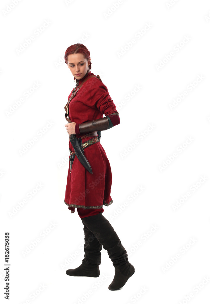 portrait of a red haired girl wearing medieval warrior outfit, studio background. portrait of a red haired girl wearing medieval warrior outfit, studio background.