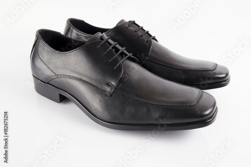 Male black leather shoe on white background, isolated product, footwear.