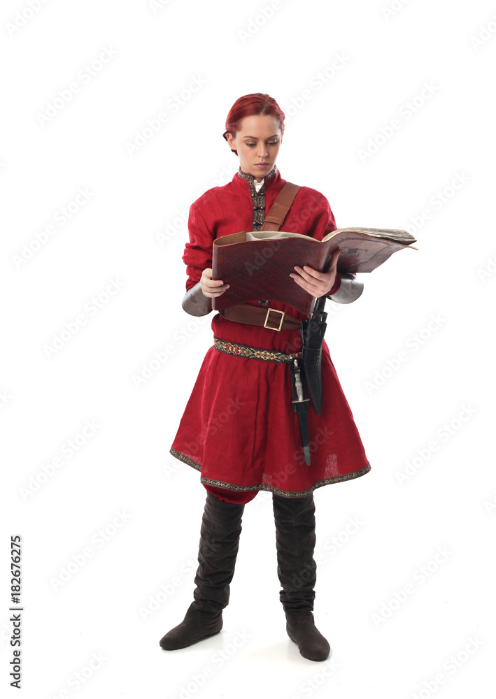 portrait of a red haired girl wearing medieval warrior outfit, studio background. portrait of a red haired girl wearing medieval warrior outfit, studio background.