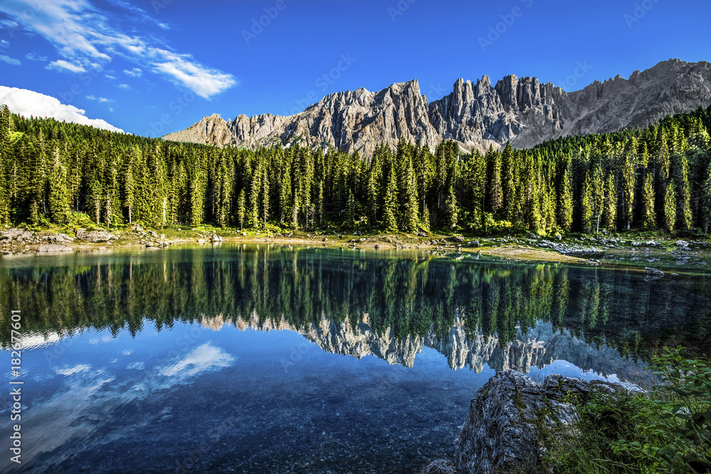 Karersee (Lago di Carezza), is a lake in the Dolomites in South Tyrol, Italy.In the background the mountain range of the Latemar group, Dolomites