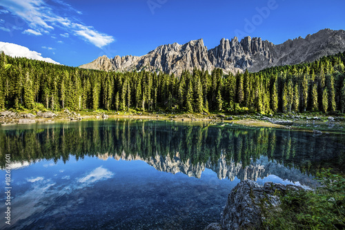 Fototapeta Naklejka Na Ścianę i Meble -  Karersee (Lago di Carezza), is a lake in the Dolomites in South Tyrol, Italy.In the background the mountain range of the Latemar group, Dolomites