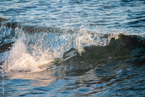 Breaking wave on a beach. © bphoto