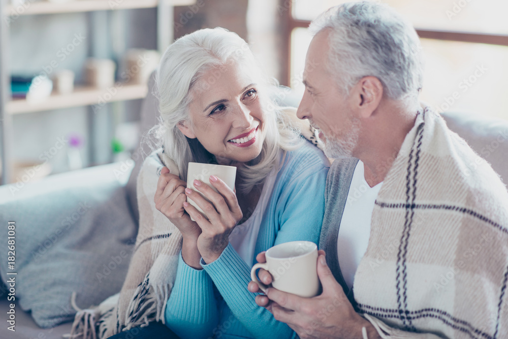 Warm sweet peaceful conversation between two full of happiness old people who are resting, relaxing, sitting at home and drinking hot coffee at the vacation Warm sweet peaceful conversation between two full of happiness old people who are resting, relaxing, sitting at home and drinking hot coffee at the vacation