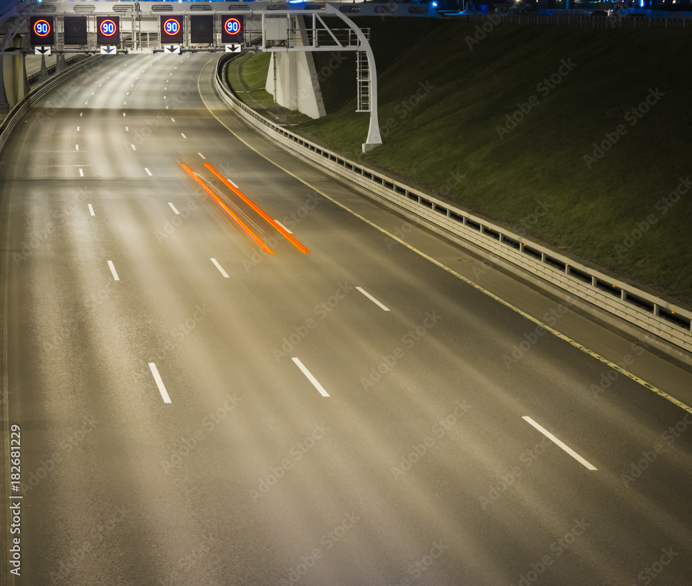 Speed Traffic at Night Time - light trails on motorway highway at night, long exposure abstract urban background Speed Traffic at Night Time - light trails on motorway highway at night, long exposure abstract urban background