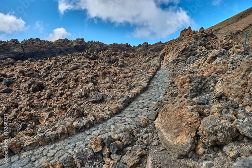 Volcano Teide and lava scenery in Teide National Park, Rocky volcanic landscape of the caldera of Teide national park in Tenerife, Canary Islands, Spain