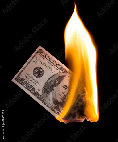 a hundred dollars burn in a fire on a black background