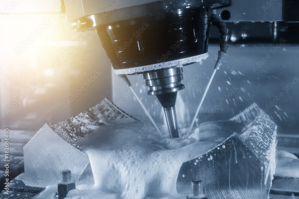 The abstract scene of 5-axis CNC Machining center cutting the automotive part.The Tyre mold part manufacturing process by 5-axis CNC machine The abstract scene of 5-axis CNC Machining center cutting the automotive part.The Tyre mold part manufacturing process by 5-axis CNC machine