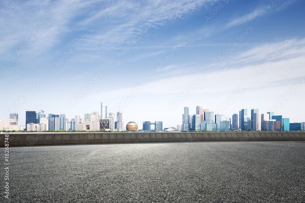 empty asphalt road with modern cityscape empty asphalt road with modern cityscape