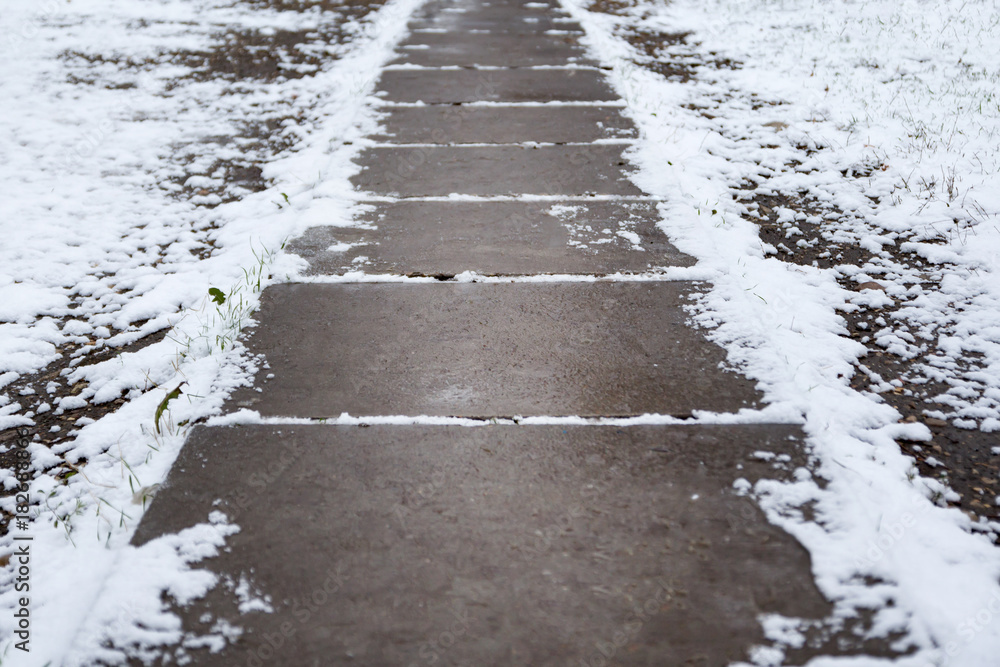 snow-covered concrete path