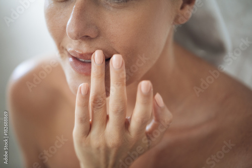 Woman Touching Her Lips Fototapet