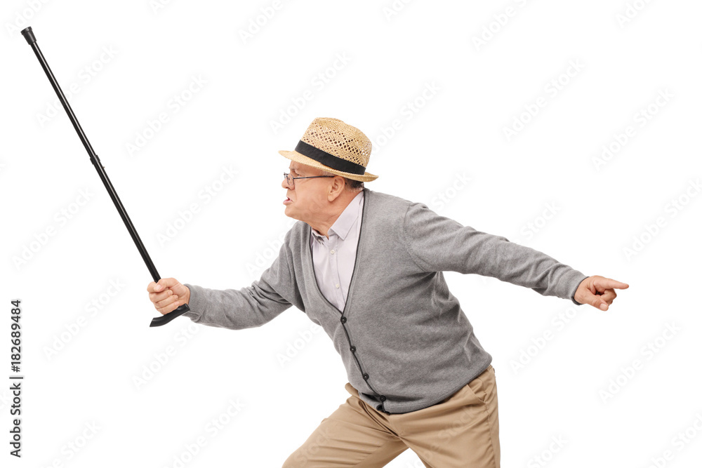 Angry elderly man holding a cane as a sword Angry elderly man holding a cane as a sword