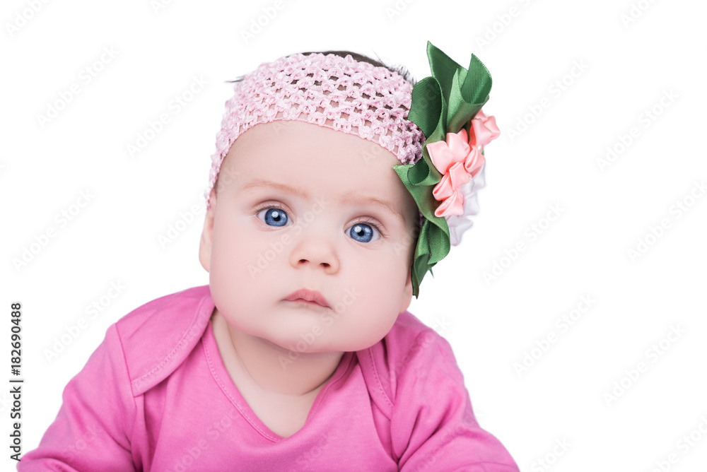 portrait of cute little baby girl with bow flower on her head. child with big blue eyes, isolated on white background portrait of cute little baby girl with bow flower on her head. child with big blue eyes, isolated on white background