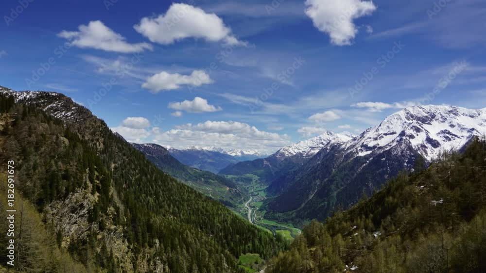 Beautiful top view of high snow-covered mountains and valley with road and village in Switzerland, timelapse 4k
Beautiful top view of high snow-covered mountains and valley with road and village in Switzerland, timelapse 4k