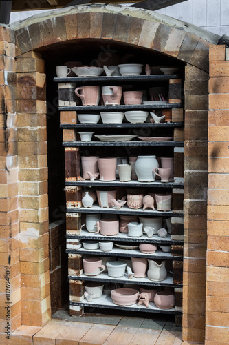 Fully packed fire brick soda kiln oblique view, handmade hobby, vertical aspect photo