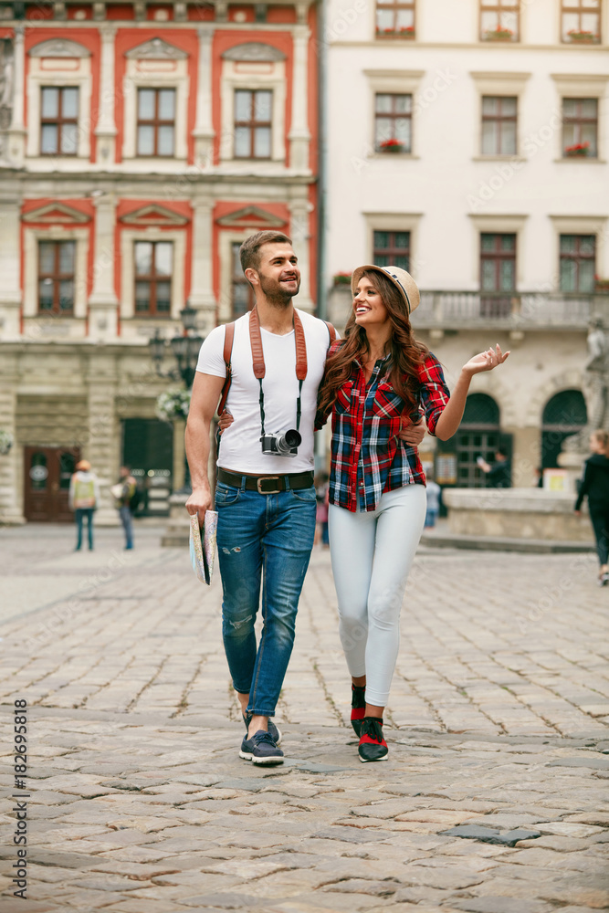 Beautiful Tourist Couple In Love Walking On Street Together.