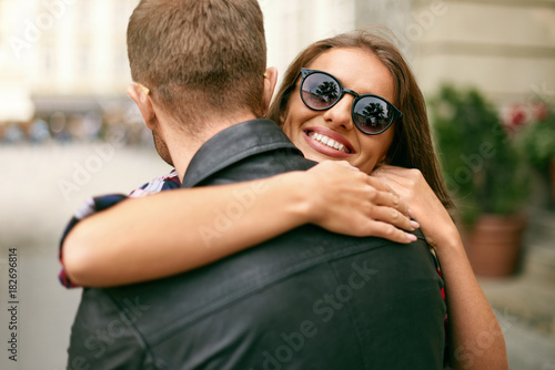 Beautiful Couple In Love Hugging On Street