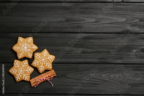 Christmas cookies with cinnamon on a black table