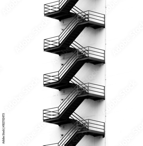 Foto Metal fire escape on facade of old building