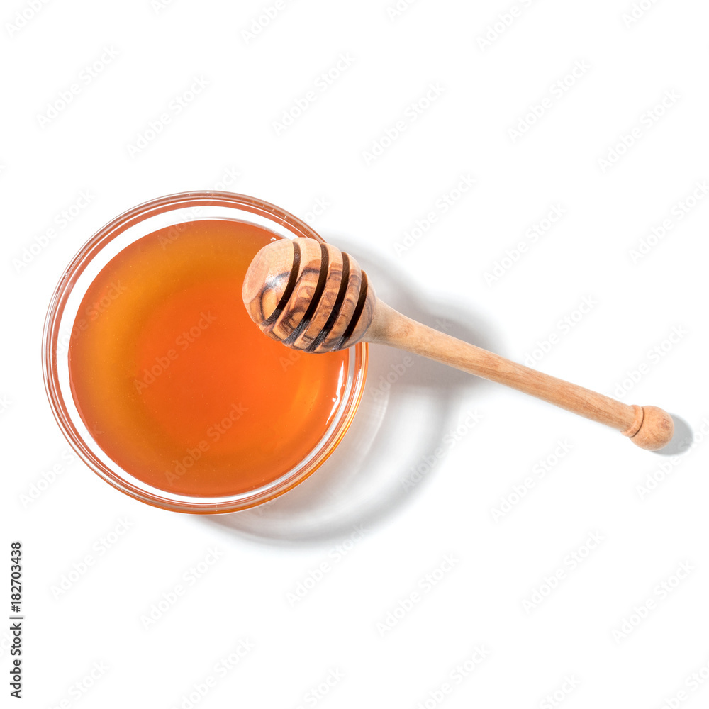 Honey dipper and honey in jar on white background. Honey dipper and honey in jar on white background.