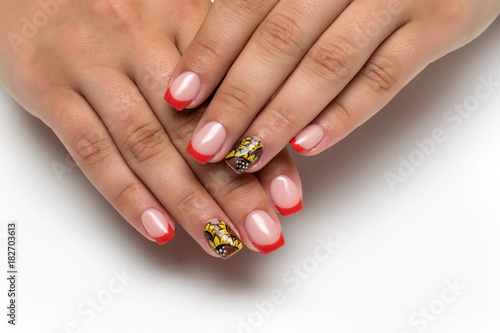 summer red French manicure with painted sunflowers on short square nails on a white background    