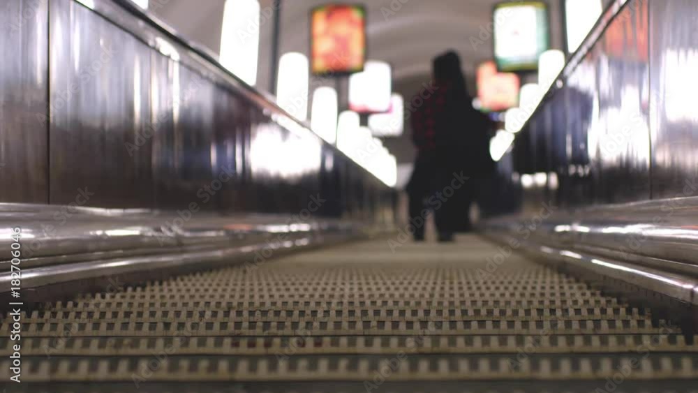 Underground escalators at rush hour. Blurred background with bokeh lights. 3840x2160, 4k Underground escalators at rush hour. Blurred background with bokeh lights. 3840x2160, 4k