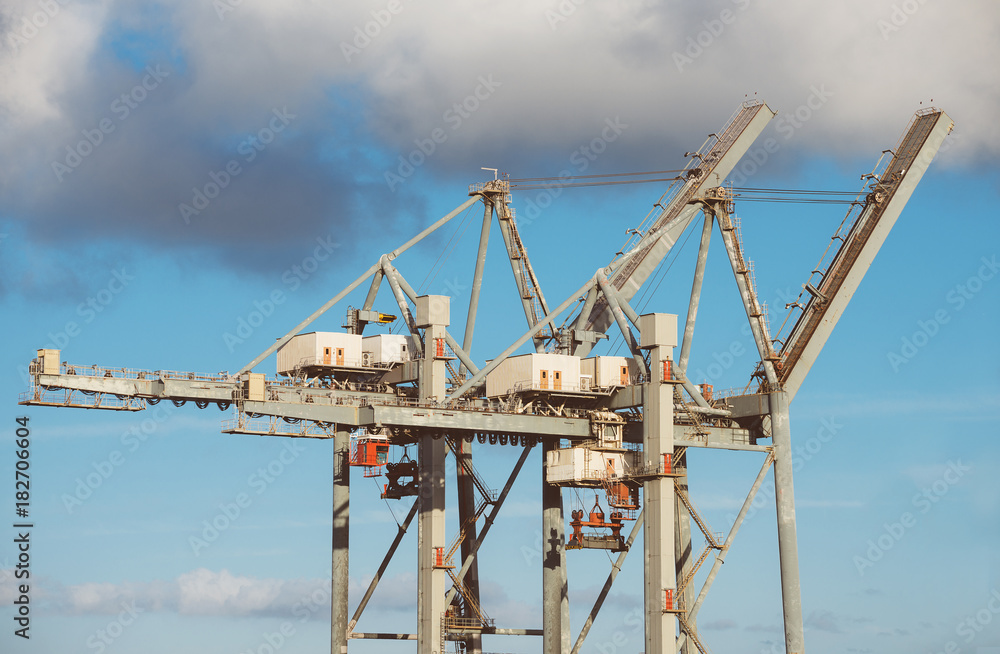 Heavy industrial sea port container cranes. Heavy industrial sea port container cranes.