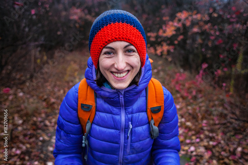 Portrait of a smiling girl with a backpack.