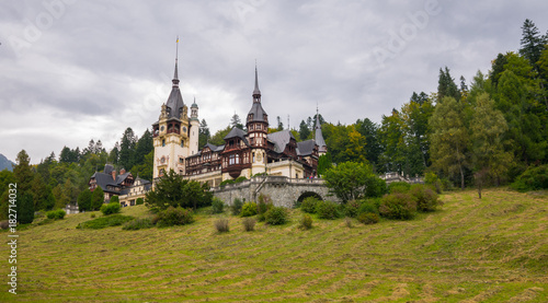 The outstanding royal residence The Peles Castle and its surrounding on a gloomy day, Sinaia, Bucegi National Park, Southern Carpathians Mountains, Transylvania, Romania