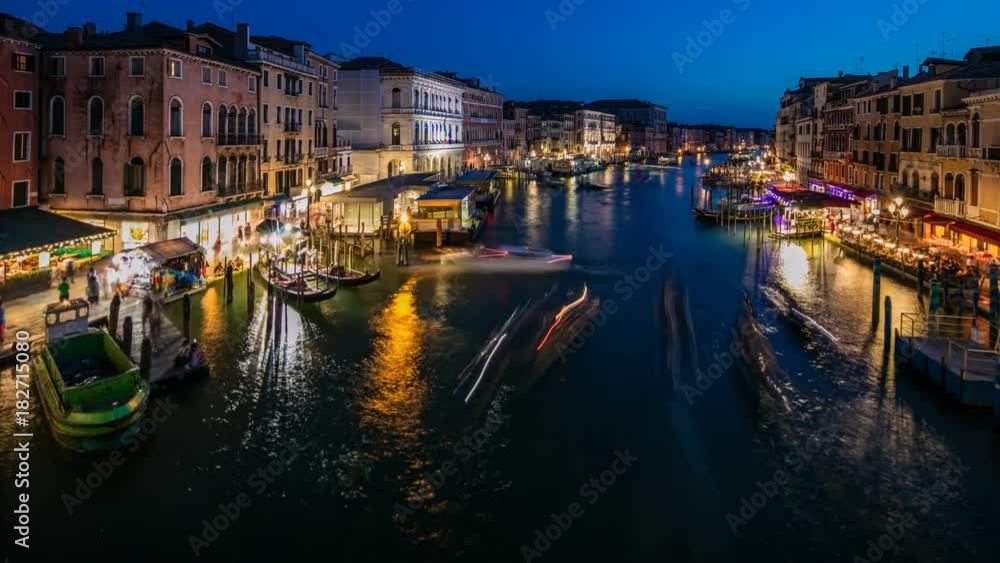 Grand Canal in Venice, Italy day to night timelapse. View on gondolas and city lights from Rialto Bridge. Grand Canal in Venice, Italy day to night timelapse. View on gondolas and city lights from Rialto Bridge.