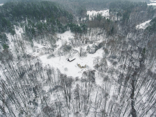 Aerial view over small village Liskiava, Lithuania. Winter season with cloudy sky. photo