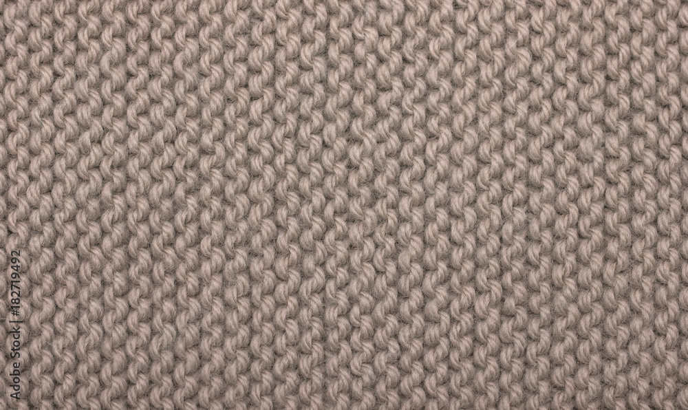 Texture of knitted woolen fabric for wallpaper and an abstract background Texture of knitted woolen fabric for wallpaper and an abstract background