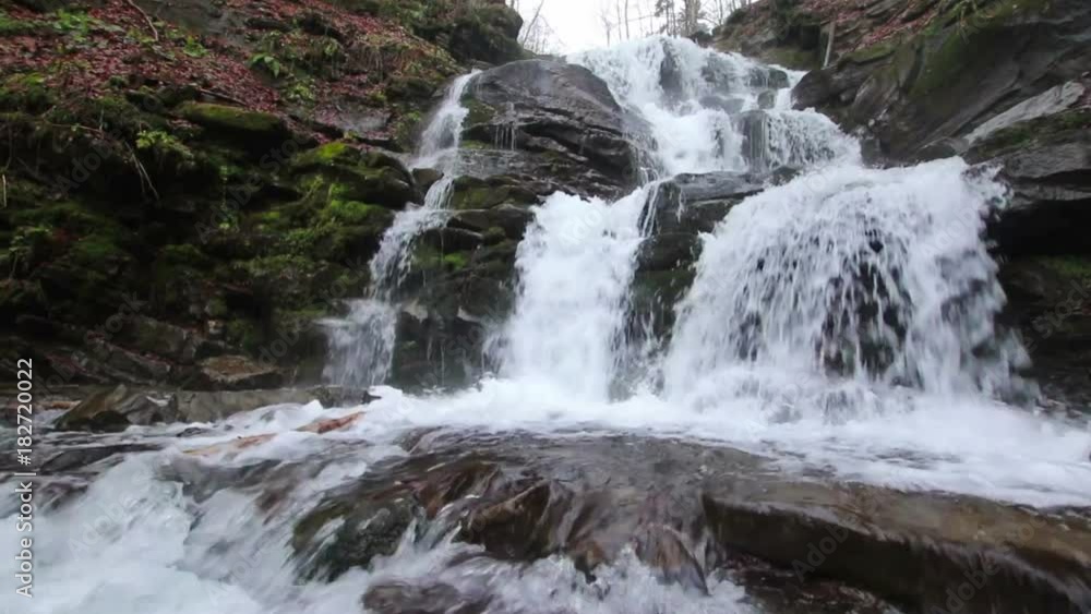Rush water of waterfall in Carpathian mountains with low angle above the water (1080p, 25fps, sound) Rush water of waterfall in Carpathian mountains with low angle above the water (1080p, 25fps, sound)