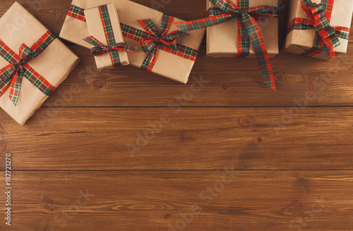 Colorful Christmas present boxes for on wooden background