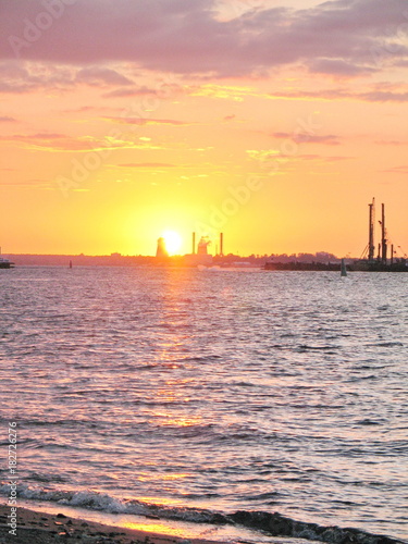 Great building bridge over the river, building cranes bridge support at sunset © Andrey