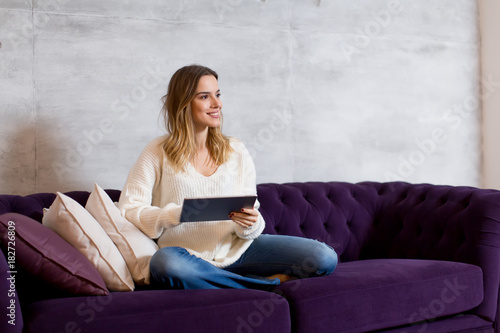 Young woman with tablet on ...