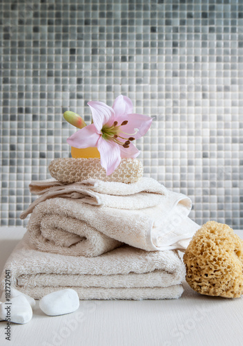 soft towel up to up grey wall and relax spa centre concept