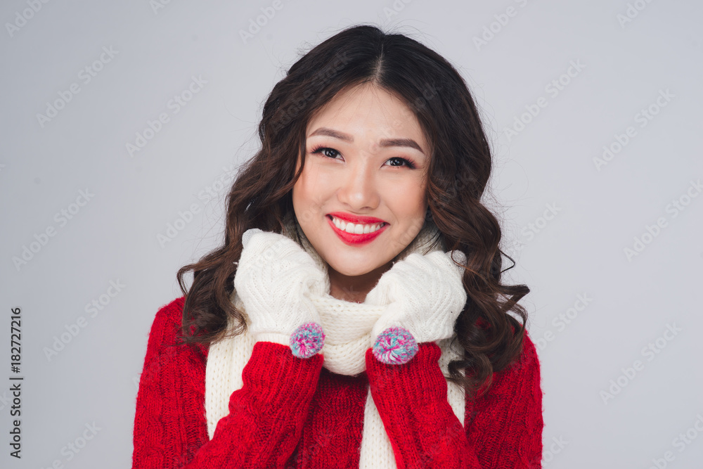 Portrait of a beautiful young asian woman in warm clothes Portrait of a beautiful young asian woman in warm clothes