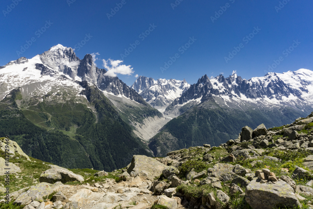 Mont Blanc massif on a sunny day in June. Alps.